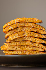 stack of pumpkin spice pancakes with a slice showing the fluffy texture