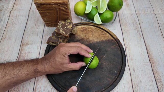 Close-up of a rustic preparation of Papel&oacute;n con Lim&oacute;n, highlighting the natural ingredients.