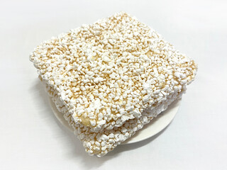 Korean Sweet Glutinous Rice Cracker (Chapssal Gangjeong) Square on White Plate 한국식 찹쌀 강정 사각 모양 하얀 접시