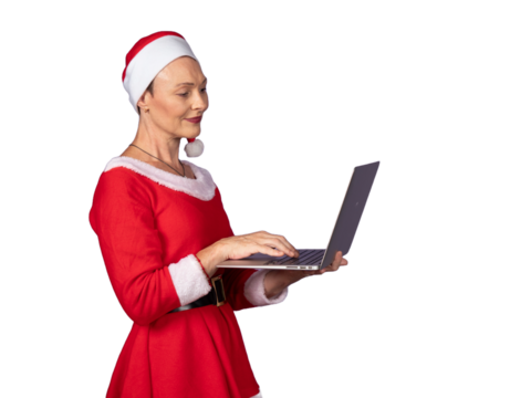 Woman in santa costume using laptop for christmas orders
