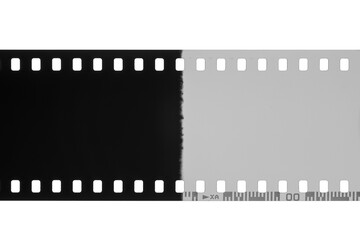 Film strip showing a contrasting transition from black to white with visible perforations isolated. Transparent PNG image.