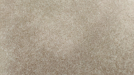 Fototapeta premium Close-up texture of a neutral beige floor, showing subtle variations in color and a soft, matte finish