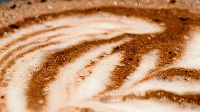 Espresso artistry a textured dance of crema and chocolate swirls, creating a decadent symphony