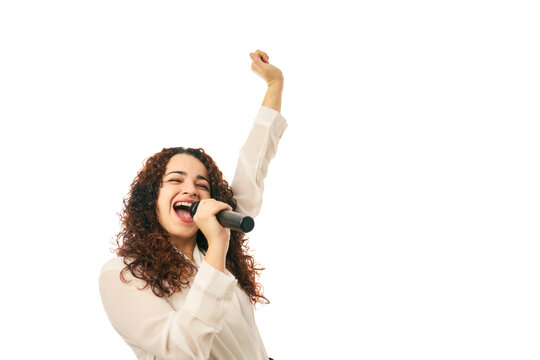 Woman singing with microphone, celebrating music and joy