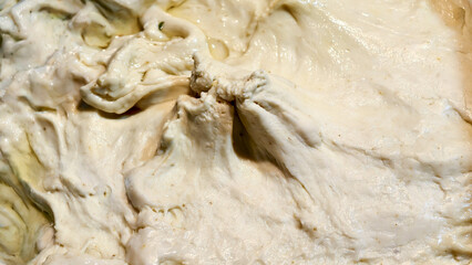 Close up of the texture of raw, oily martabak dough