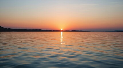 Sunset over still water