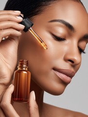smiling woman's face and eye as she applies a drop of anti-aging facial serum or cosmetic oil with a glass pipette.