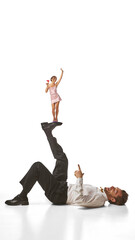 Bright poster. Tiny woman standing on man raised leg with cocktail in hand. Concept of balance, relationship dynamics, and joyful gender role reversal for fashion, pop culture, and editorial use.