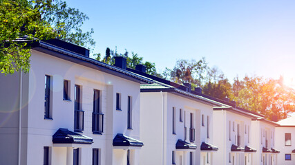 Newly built terraced houses in a residential area. Modern terraced houses on the outskirts of the...