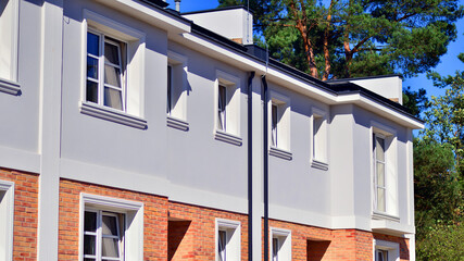 Newly built terraced houses in a residential area. Modern terraced houses on the outskirts of the city.