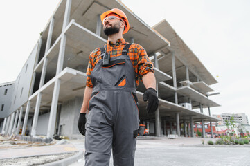 Construction worker man walking on building site