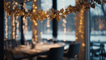 Interior view of a restaurant with holiday decorations, blurred lights, and a window view