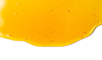 Honey dripping, pouring, flowing over white background. Close-up. Healthy organic liquid sweet sticky honey dipping, isolated on white, closeup. Border art design 