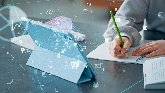 タブレットを見ながら勉強する女の子と通信ネットワーク　eラーニング