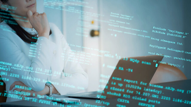 Image of a woman thinking in the office and programming