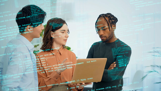Multinational group having a conversation in an office with digital technology
