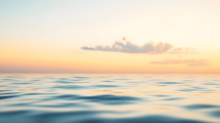 Fototapeta premium Gentle ocean waves meet a pastel sky at sunset.