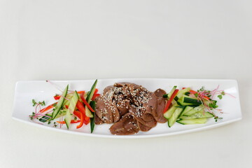 Spicy Grilled beef with Cucumber Salad,grilled meat with onion and sliced cucumber in chilli lime sauce.(Yum Neua Yang)
