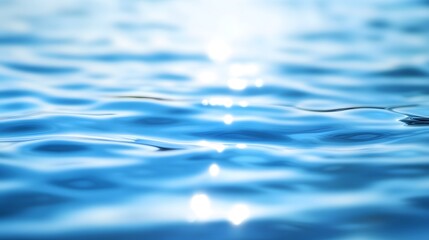 A close-up view of rippling, translucent blue water, showcasing the subtle light reflections and smooth surface textures.