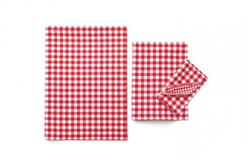 Red plaid outfit set on a white backdrop. Picnic blanket. Aerial perspective