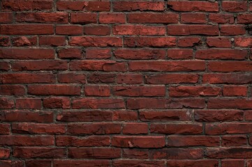 Fototapeta premium Grungy background featuring red brick wall texture