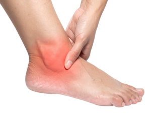A person holding their ankle, showing redness and swelling, likely indicating an injury or condition affecting the foot.