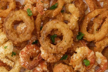 Assortment of Crispy Prawns, Onion Rings, and French Fries