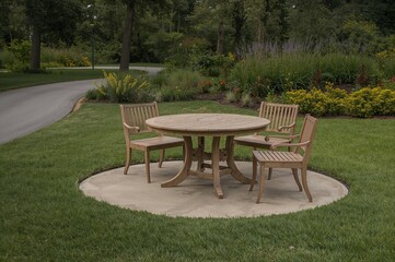 Obraz premium Wooden outdoor dining set with chairs and benches placed on circular concrete patio surrounded by grass and pathway in a park, unoccupied.