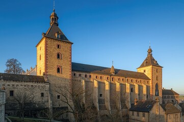 Fototapeta premium Scenic Fortification Walls Featuring Iron Rooftops and Watchtowers