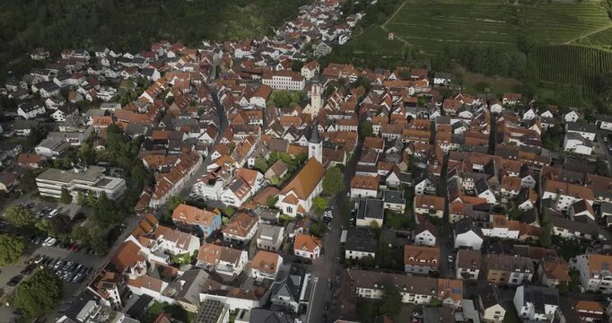Aerial view of the charming town of Schriesheim, with its terracotta rooftops and the prominent Schriesheim Church, Schriesheim, Baden-Wurttemberg, Germany.