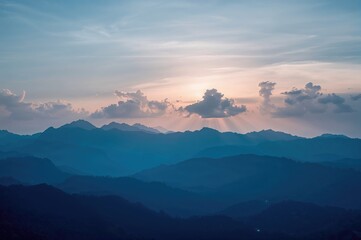Simple sunrise over hills with a cloudy backdrop