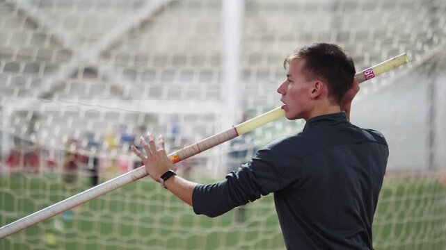 Young athlete preparing for a pole vault jump