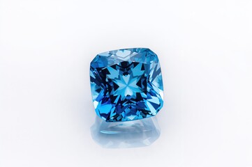 Isolated natural blue topaz gemstone on a plain white backdrop