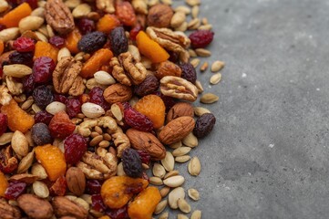 Assortment of dried fruits, nuts, and seeds with selective focus