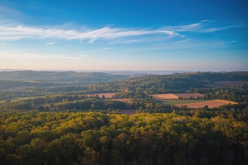 Obraz premium Drone captured long exposure shot of a scenic forest and open field