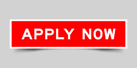 Red color square shape sticker label with word apply now on gray background
