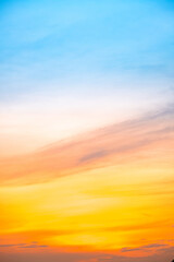Beautiful , luxury soft gradient orange gold clouds and sunlight on the blue sky perfect for the background, take in evening,Twilight, Large size, high definition landscape photo,Vertical