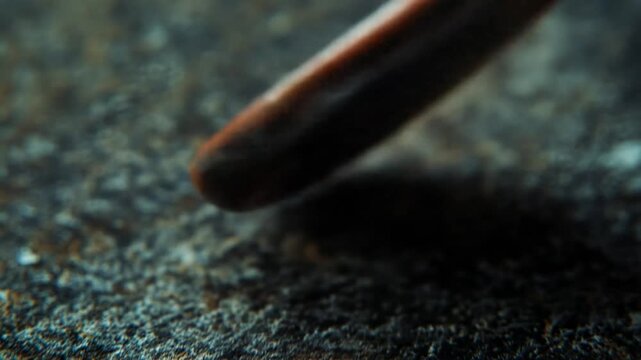 Close up of weathered metal golf club with red accents