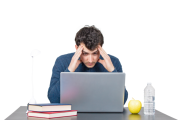Overworked young male student seated at the working desk in front of a laptop studying. Hard learning male looking fatigue for answers in his computer, isolated portrait on transparent background