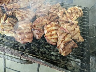 thai style grilled pork juicy meat sizzlingon on the grill