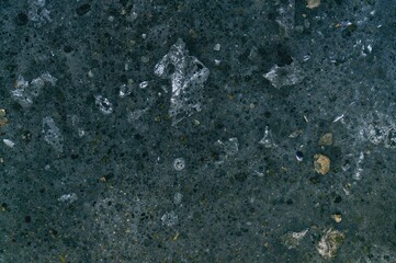 Optical microscope image revealing graphite flakes embedded in a pearlite and alpha ferrite matrix of gray cast iron after sample preparation.