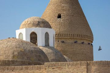 Dome from baked brick of Chashma-Ayub Mausoleum against blue sky background in Bukhara, Uzbekistan. Built in the 12th-16th centuries