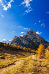 Dolomites mountains view with golden larch in Cortina d'Ampezzo, Italy