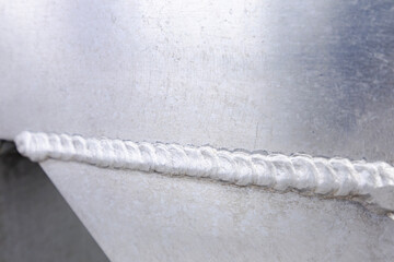 Fototapeta premium Welded aluminum structure. Welded seams of aluminum joints.
