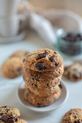 A plate of fresh baked oatmeal and chocolate chip cookies