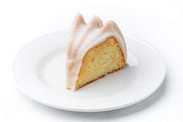 Slice of Lemon Drizzle Cake with Icing Glaze
