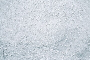 Obraz premium Wide textured surface of whitewashed pebble dash wall