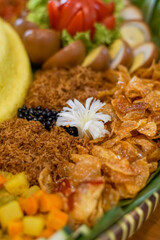 Close-up of Tumpeng Yellow Rice with Serundeng and Fried Potatoes — Traditional Indonesian Food