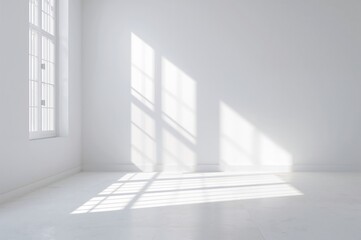 Obraz premium Bright studio space illuminated by sunlight with shadow patterns