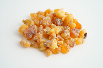 Frankincense or olibanum aromatic resin isolated on white background used in incense and perfumes.